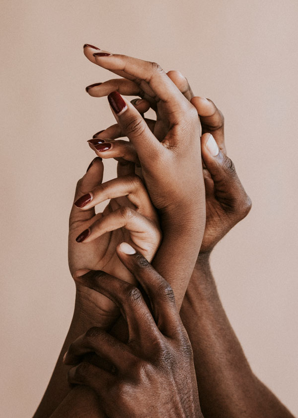 A group of hands reaching up